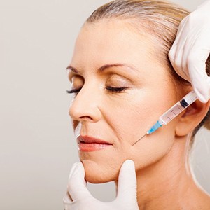 Lady receives BOTOX® injection